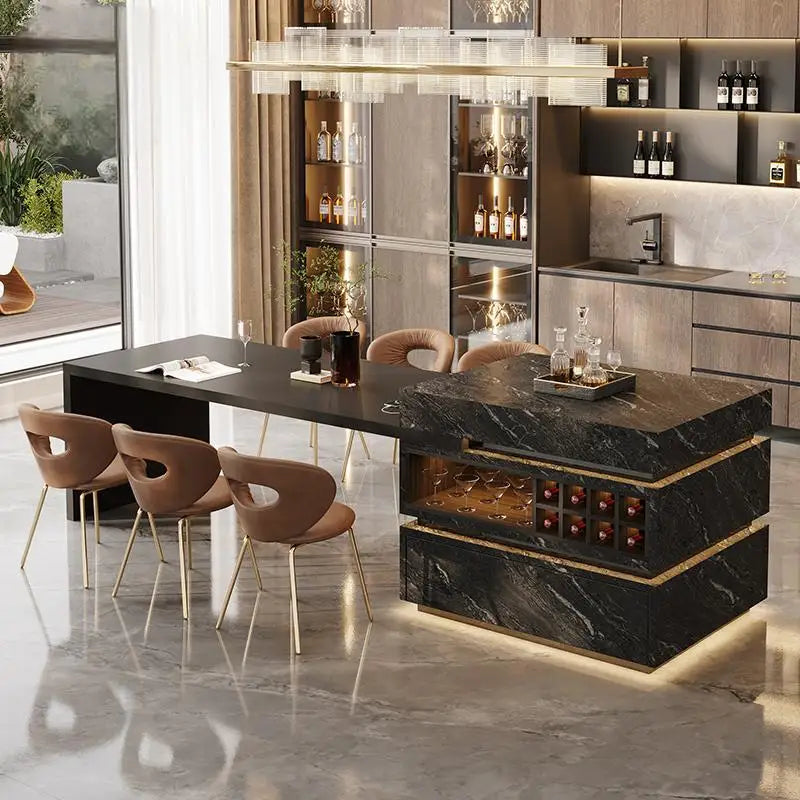 Modern kitchen island with marble finish and wine storage, surrounded by chairs.