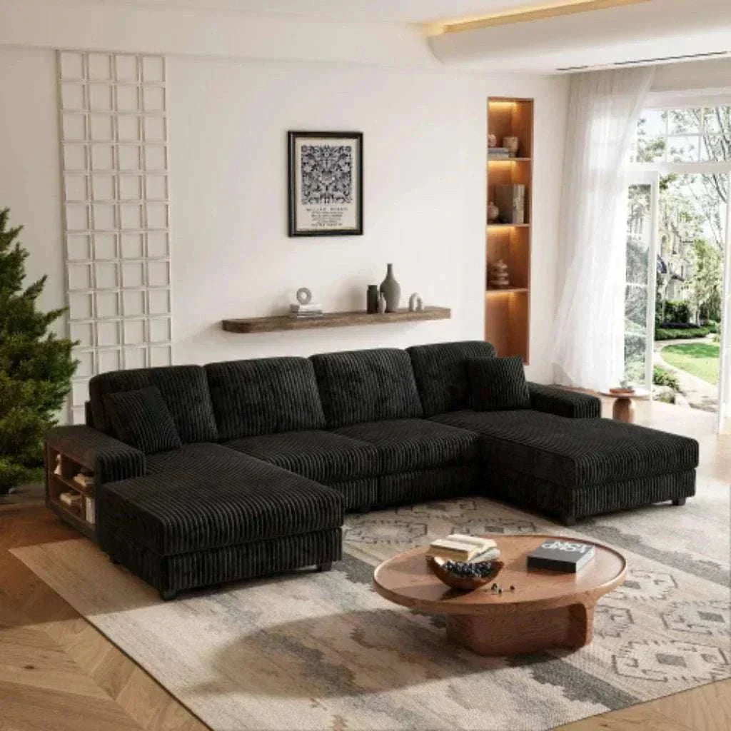 Modern living room with a black sectional sofa and wooden coffee table.