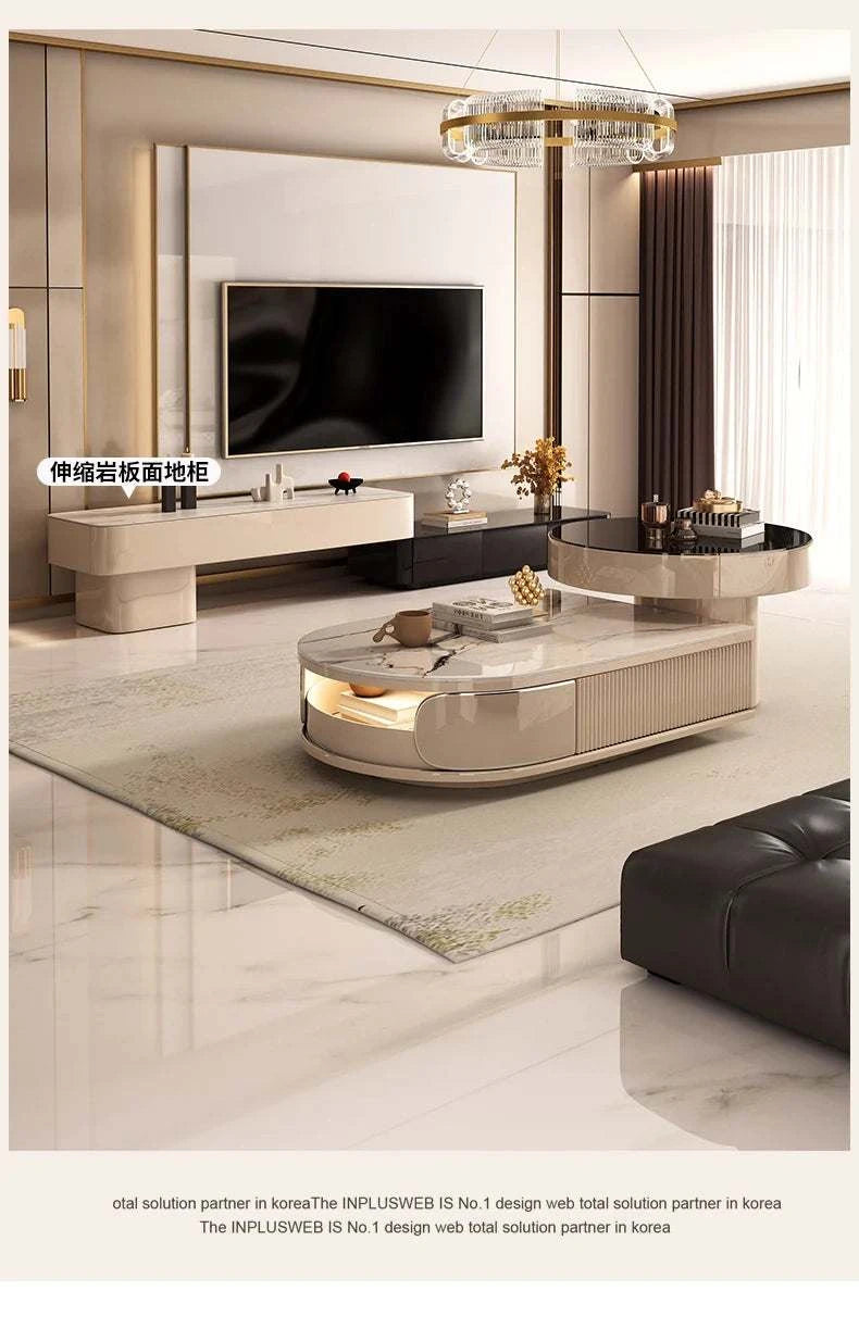 Modern living room with a television and decorative items on a coffee table.