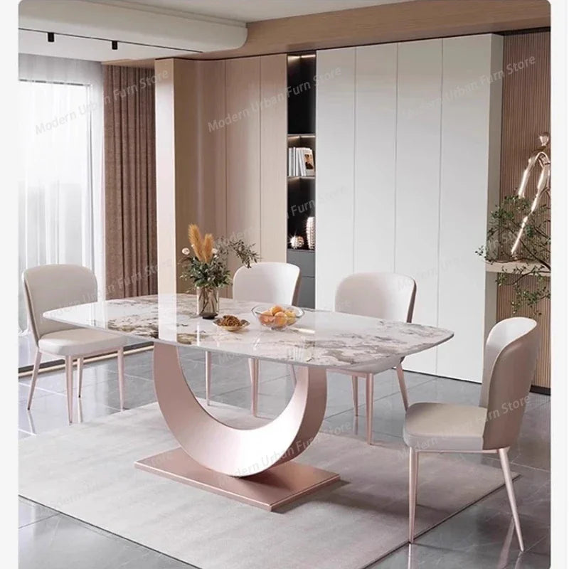 Luxury Nordic Dining Table and Chairs Set featuring a sleek marble top and modern design in a stylish dining room.