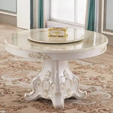 Decorative round table with intricate designs in a room with patterned carpet and curtains.