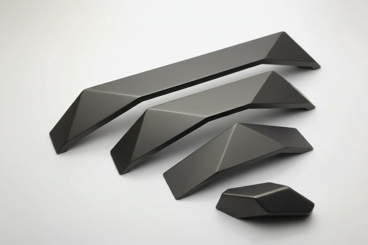 Four gray geometric furniture legs or decorative base components arranged on a plain white background, with a faint website watermark across the middle.