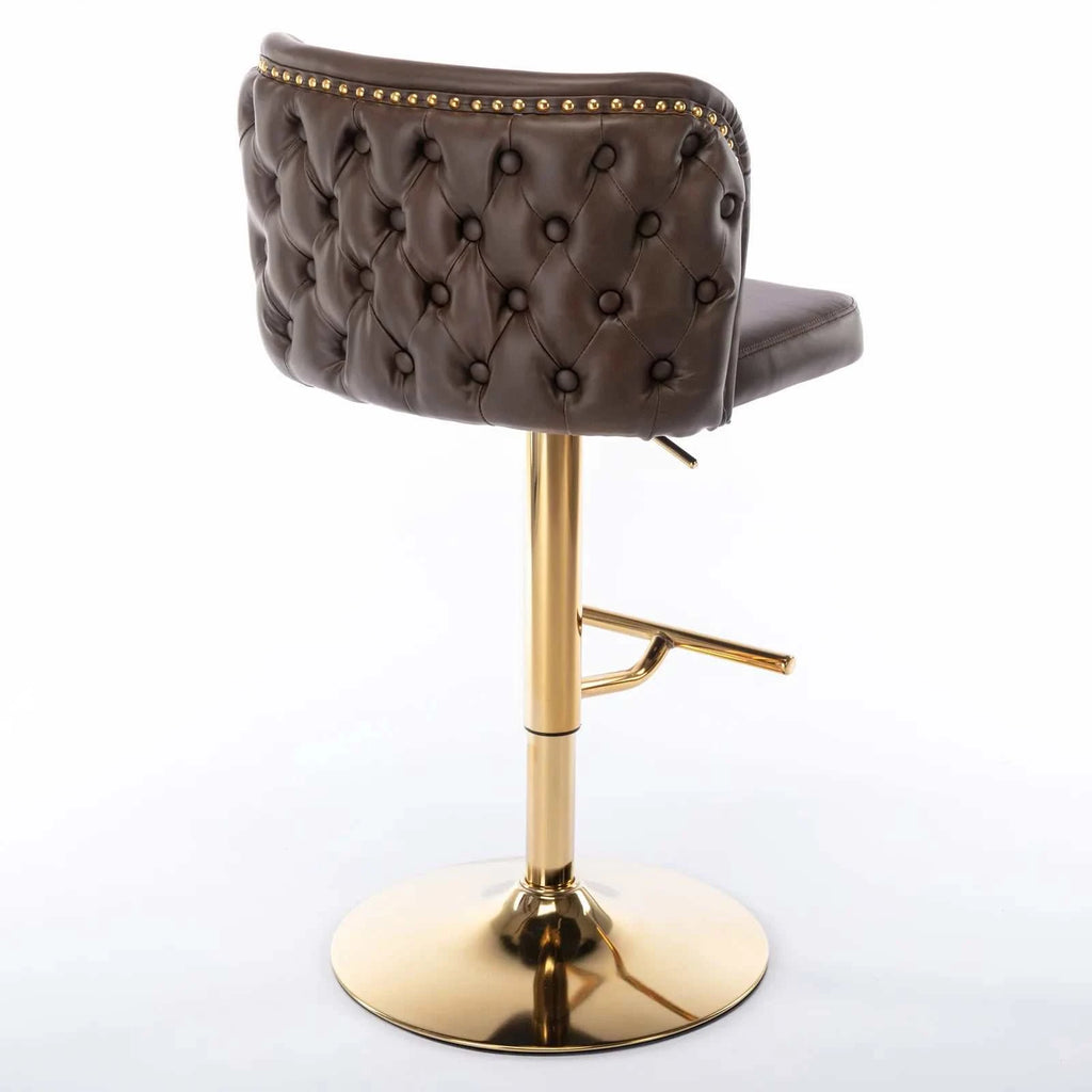 Brown tufted bar stool with gold accents on a white background