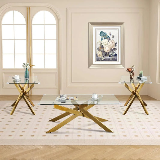 Modern glass coffee table with gold metal legs in a living room setting.