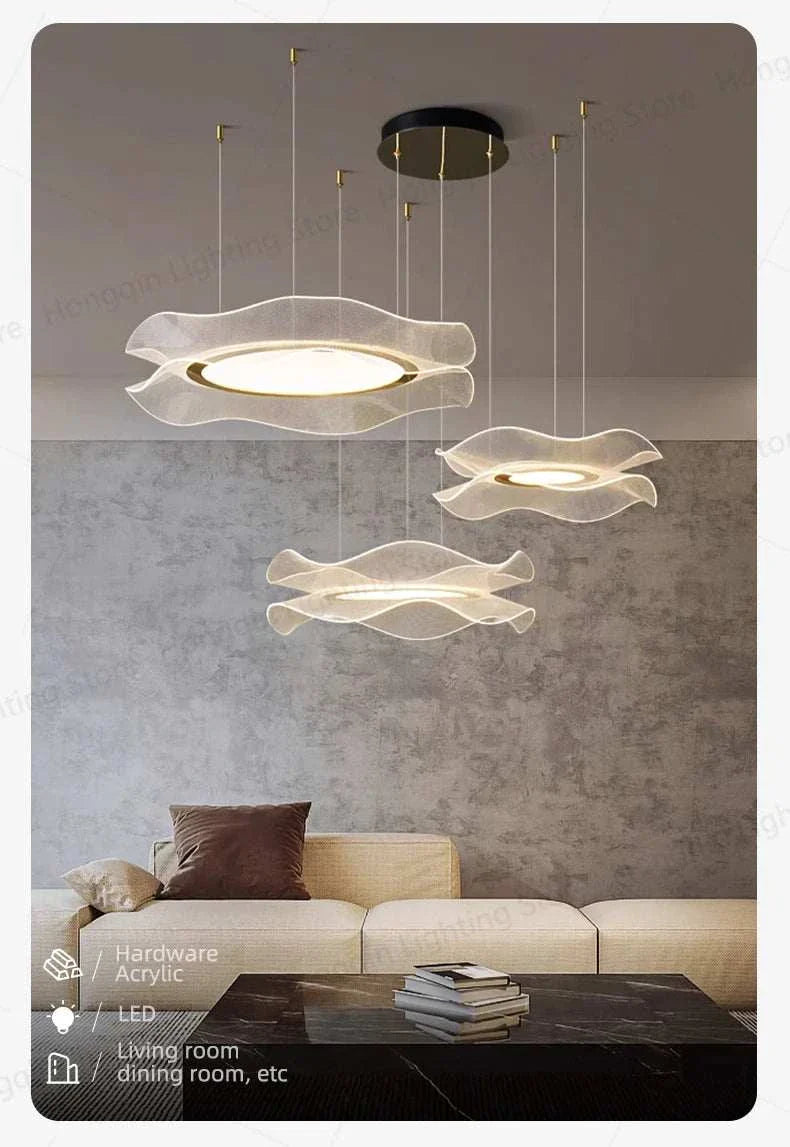 Round modern LED ceiling chandelier with minimalist acrylic design and soft lighting above living room sofa