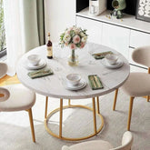 round dining table for 4 set for a meal with floral centerpiece and elegant tableware