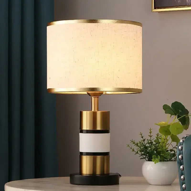 Luxury LED bedside lamp with metal frame and fabric shade, ideal for modern bedroom or home office lighting.