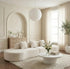Modern living room with a white sofa, coffee table, and decorative elements.