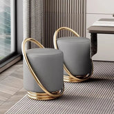 Nordic modern dressing table set with stylish gray stools featuring gold accents and round design.