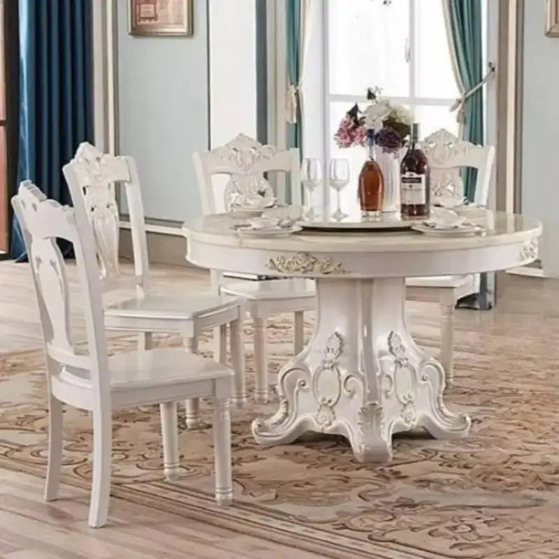 4 person gold dining table in a modern living room setting with elegant chairs and stylish decor.