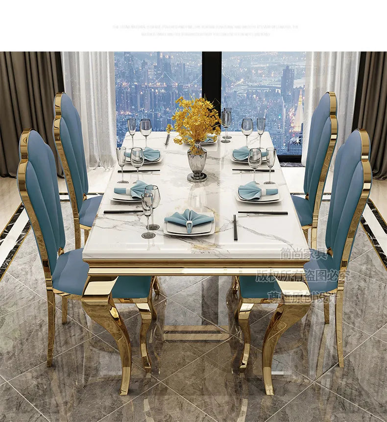 luxury marble dining table with gold base featuring elegant blue chairs, set for six in a stylish dining room.
