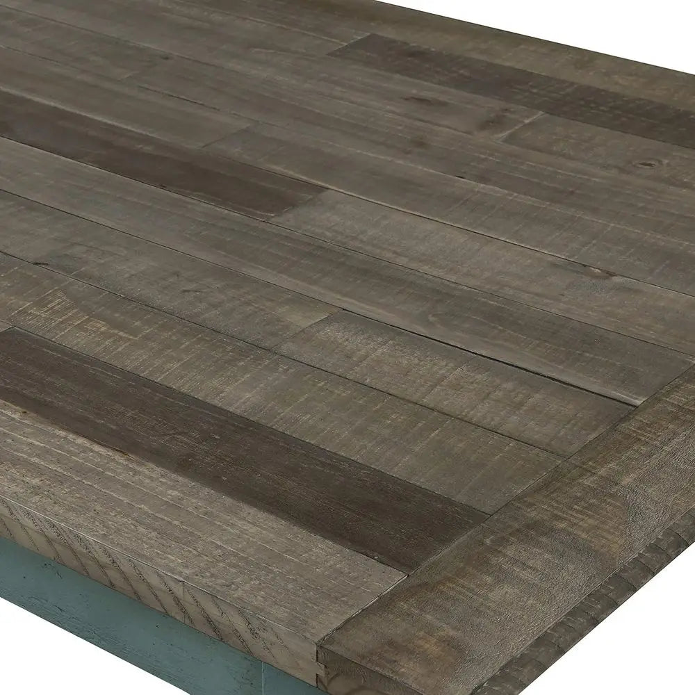 Close-up view of the rustic wooden surface of the Farmhouse Dining Set Antique Blue.