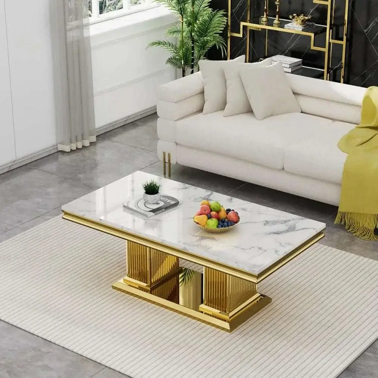 Stylish white faux marble coffee table set with gold accents, enhancing modern living room space.