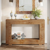 Wooden console table with decorative items in a room setting
