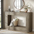 Wooden console table with decorative items in a room with a large mirror and window.
