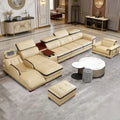 Luxury leather sectional sofa with massage chaise in a modern living room setting.