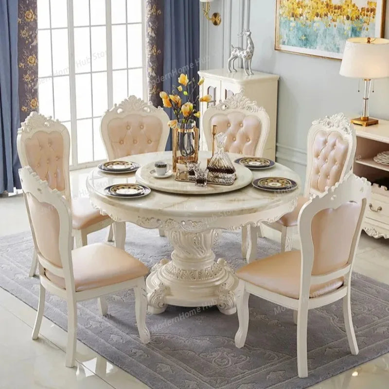 european marble round dining table with solid wood base and upholstered chairs in elegant dining room setting