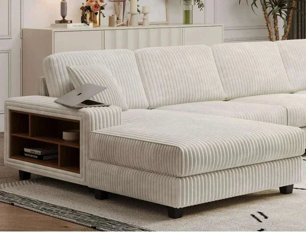 Beige sectional sofa with wooden side table in a living room setting