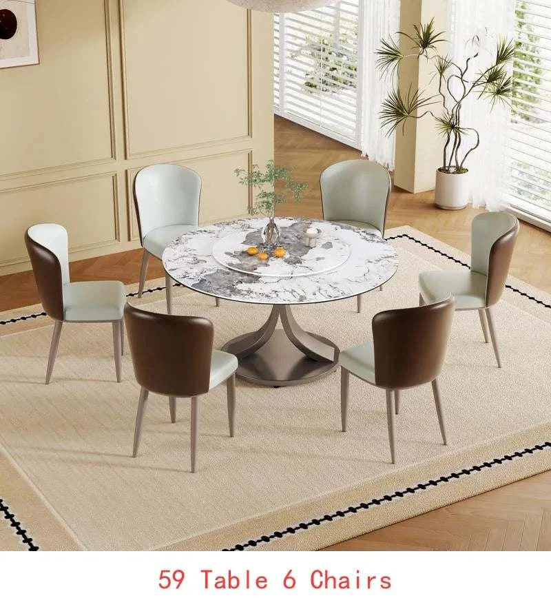 Dining room with a round table and six chairs on a beige rug.