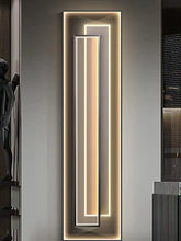 Modern LED Creative Mural Light | Vertical Art Deco Hanging Lamp illuminating a sleek vertical design on a wall.