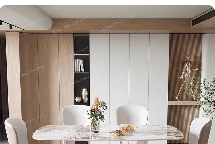 Luxury Nordic dining set featuring a sleek slate tabletop and elegant white chairs in a modern dining space.