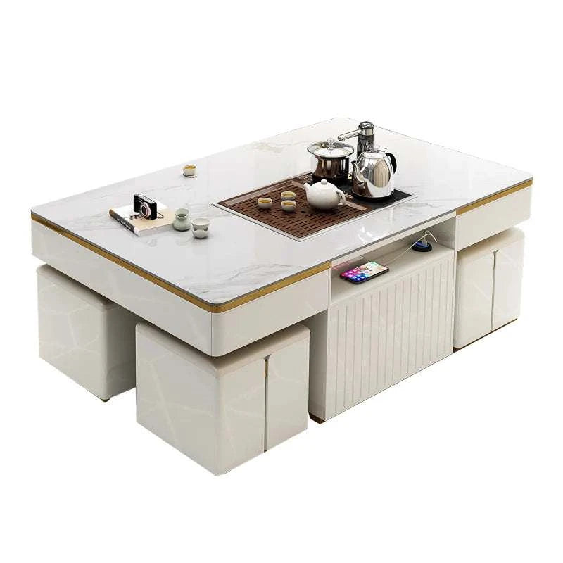 Modern white coffee table with tea set on a white background