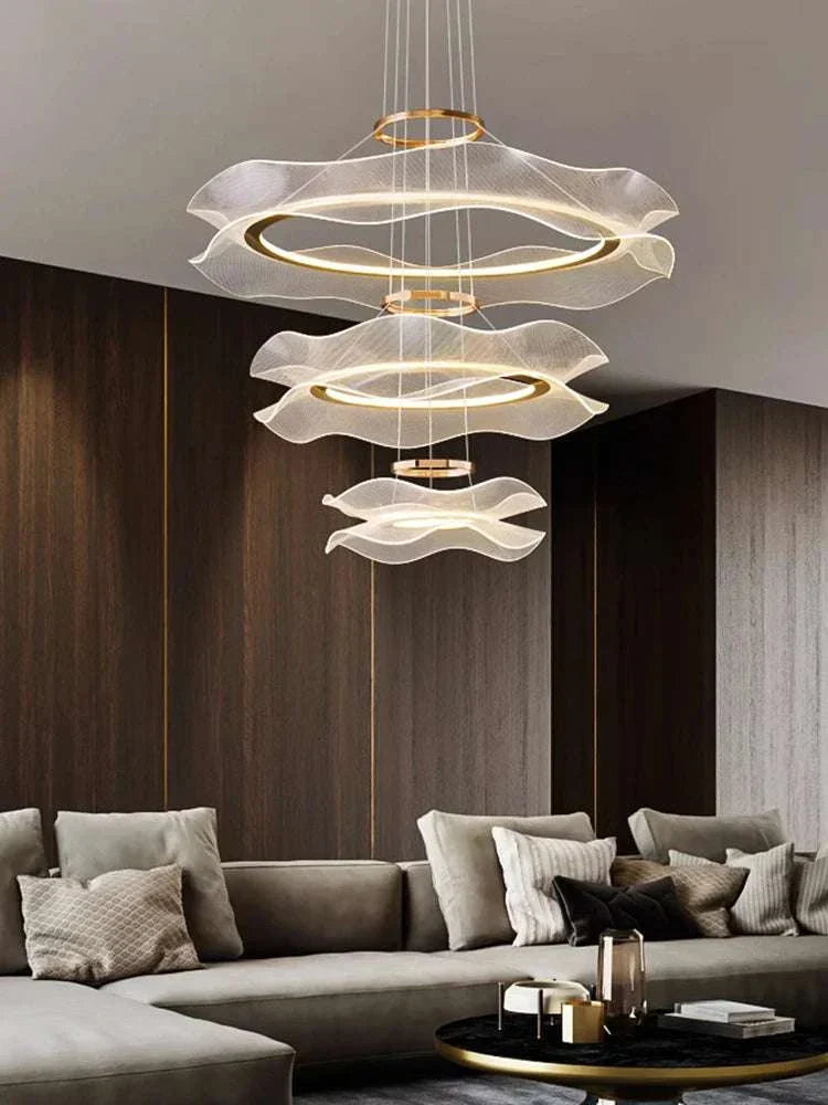 Round modern LED ceiling chandelier with layered translucent rings above a living room sofa