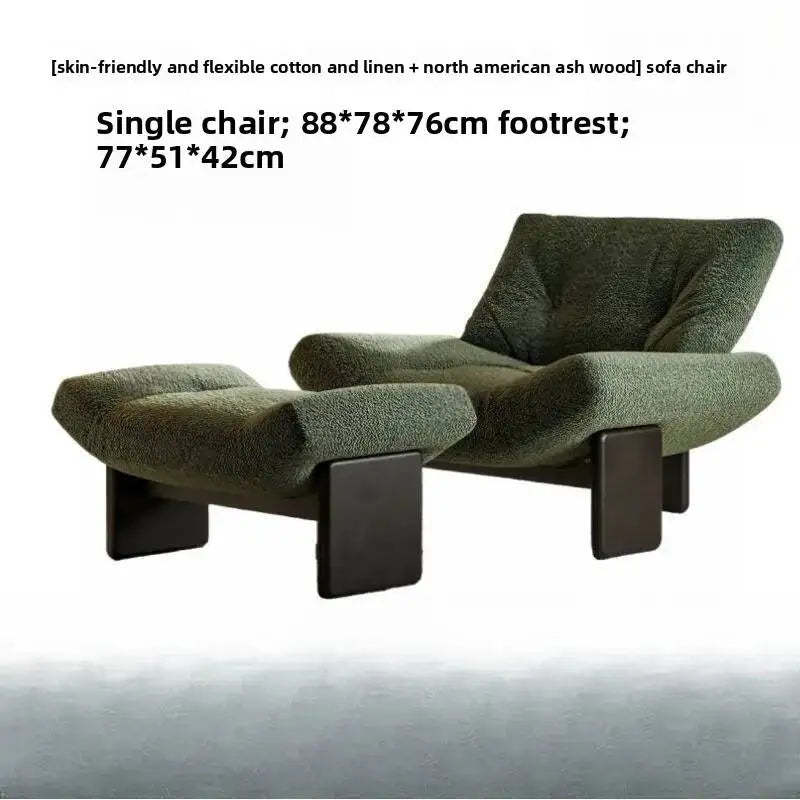 Green sofa chair with footrest on a white background