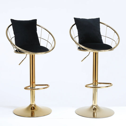 Two gold bar stools with black cushioned seats on a white background