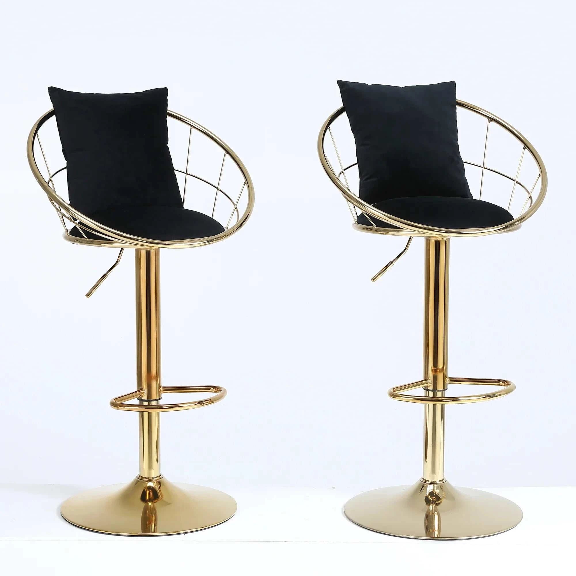 Set of 2 black velvet bar stools with gold metal legs and 360-degree swivel design