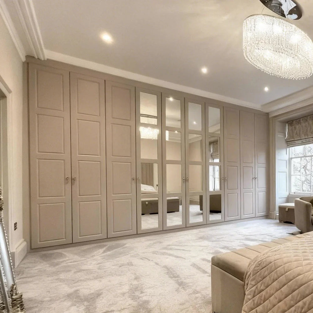 Large wardrobe with mirrored doors in a bedroom setting