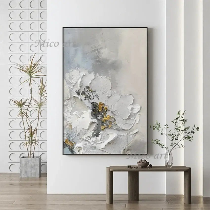 Abstract art piece on a wall with decorative elements and plants.