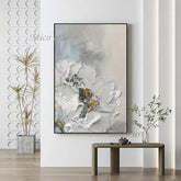 Abstract art piece on a wall with decorative elements and plants.