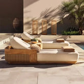 Solid Teak Wood Outdoor Sun Lounger Chaise with plush cushions by poolside in a stylish outdoor setting.