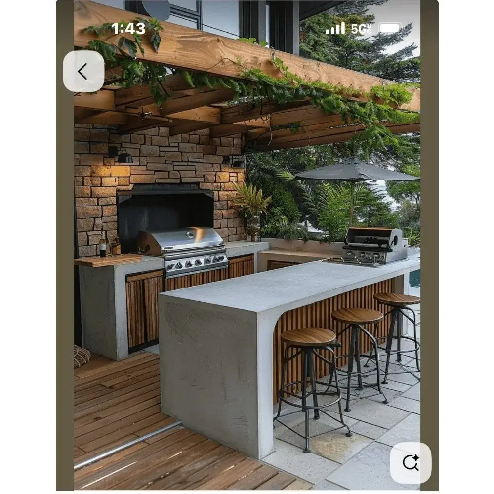 stainless steel outdoor kitchen cabinet with gas grill, bar stools, and modern design in a garden patio setting.