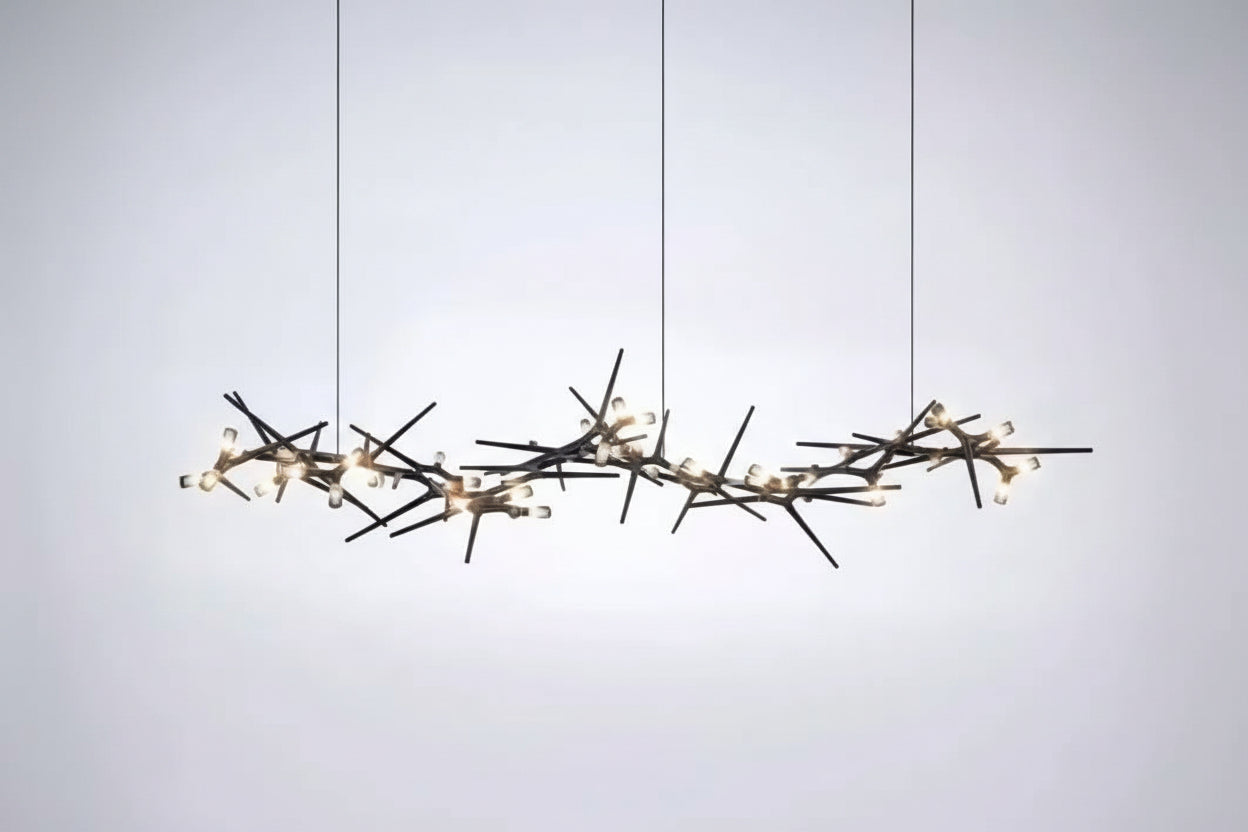 Modern chandelier with branch-like design on a white background
