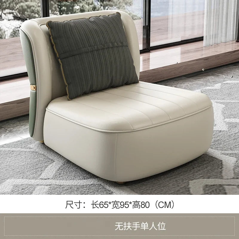 Beige armchair with a dark green pillow on a patterned rug