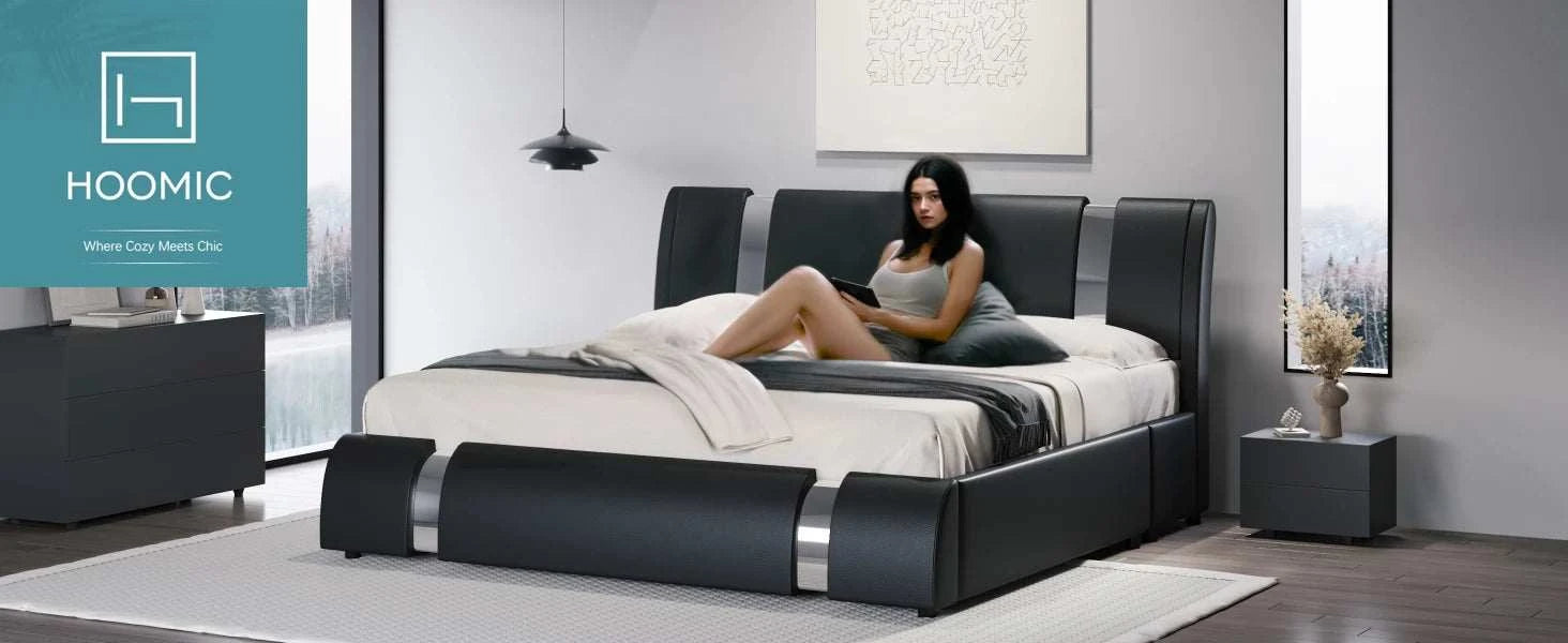 Woman sitting on a modern bed in a stylish bedroom with 'HOOMIC' branding.
