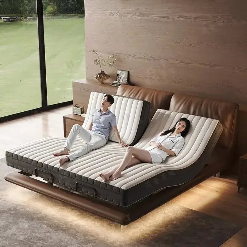 Luxury adjustable smart bed with two individuals enjoying the adjustable features in a modern bedroom.