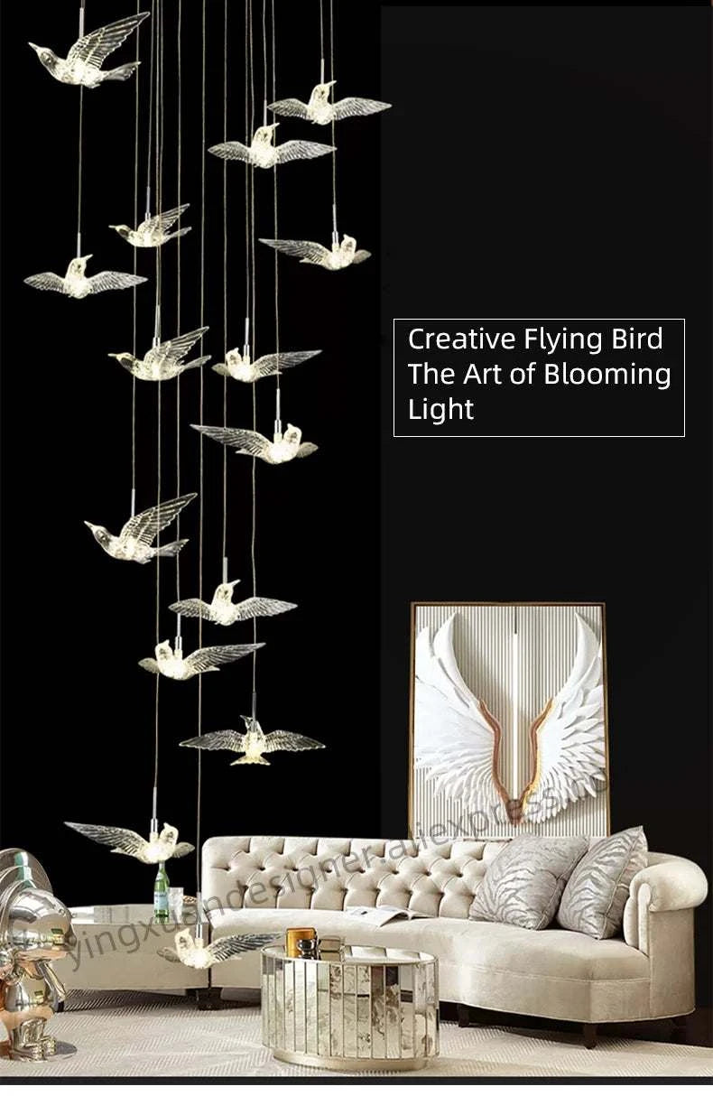 Modern living room with a decorative chandelier featuring flying bird designs.
