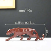 Red tiger figurine with dimensions on a dark background
