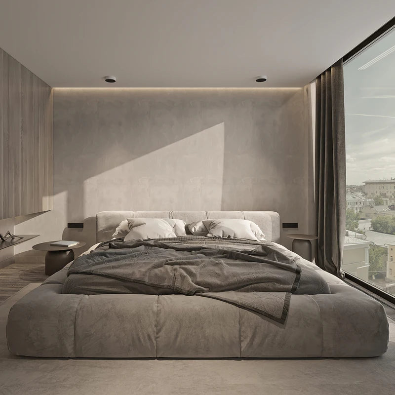 Italian upholstered bed frame in a modern bedroom with large windows and soft bedding, featuring a minimalist design.