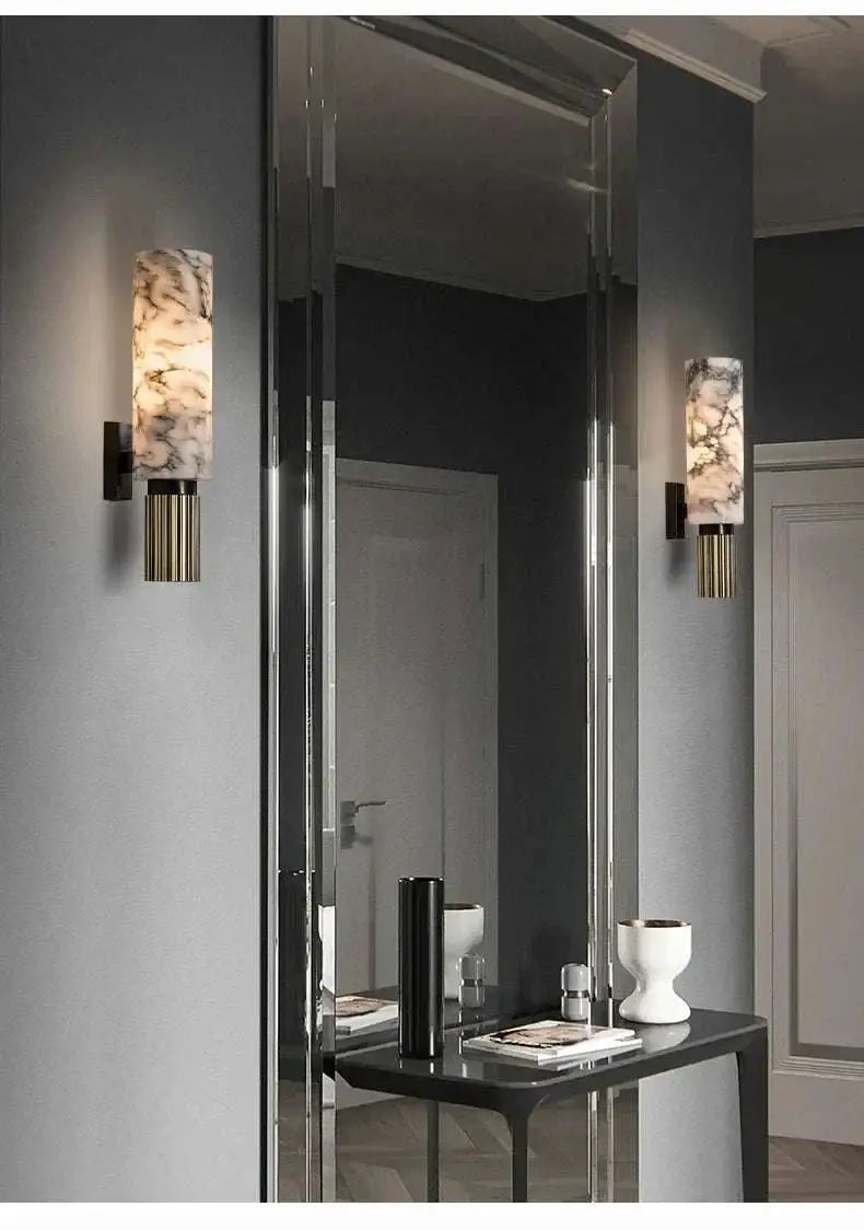 Modern wall sconces with decorative glass shades in a stylish interior setting.