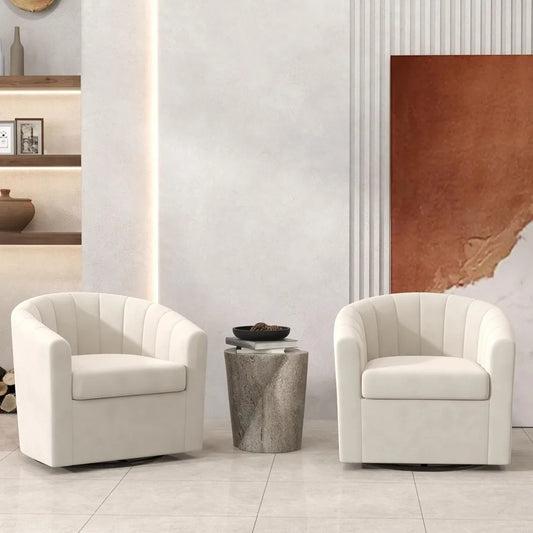 Two white armchairs in a modern living room setting with a neutral color palette.