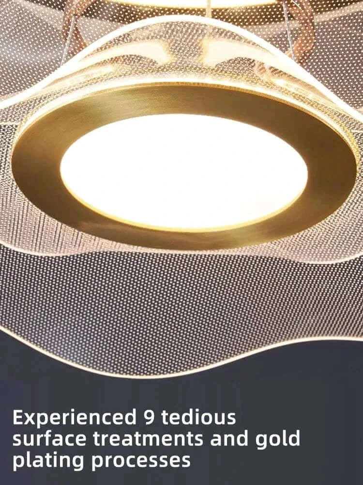 Close-up of a round modern led ceiling chandelier showcasing its gold plating and intricate surface treatments.