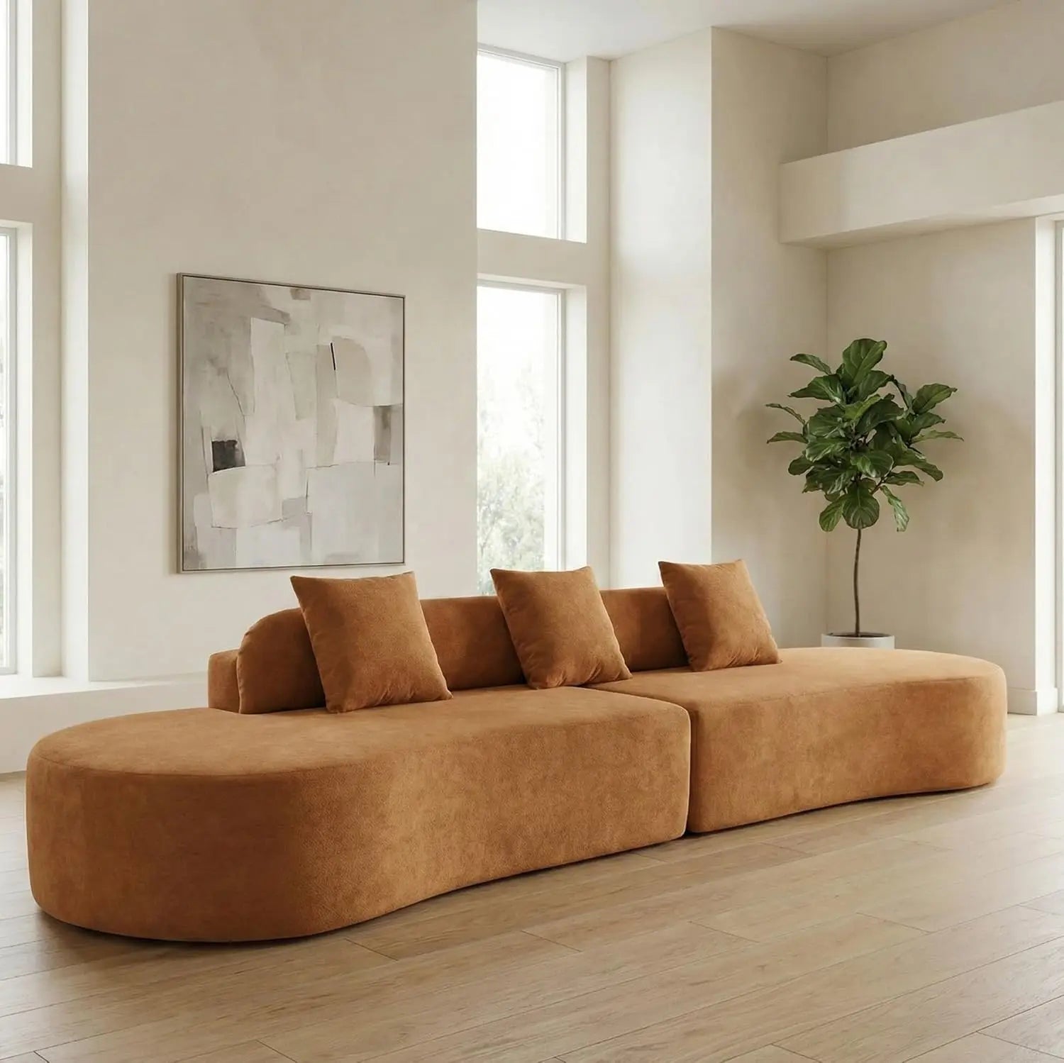 Brown sectional sofa in a modern living room with large windows and a plant.