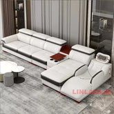 Luxury leather sectional sofa with massage chaise in modern living room, featuring cup holders and sleek design.