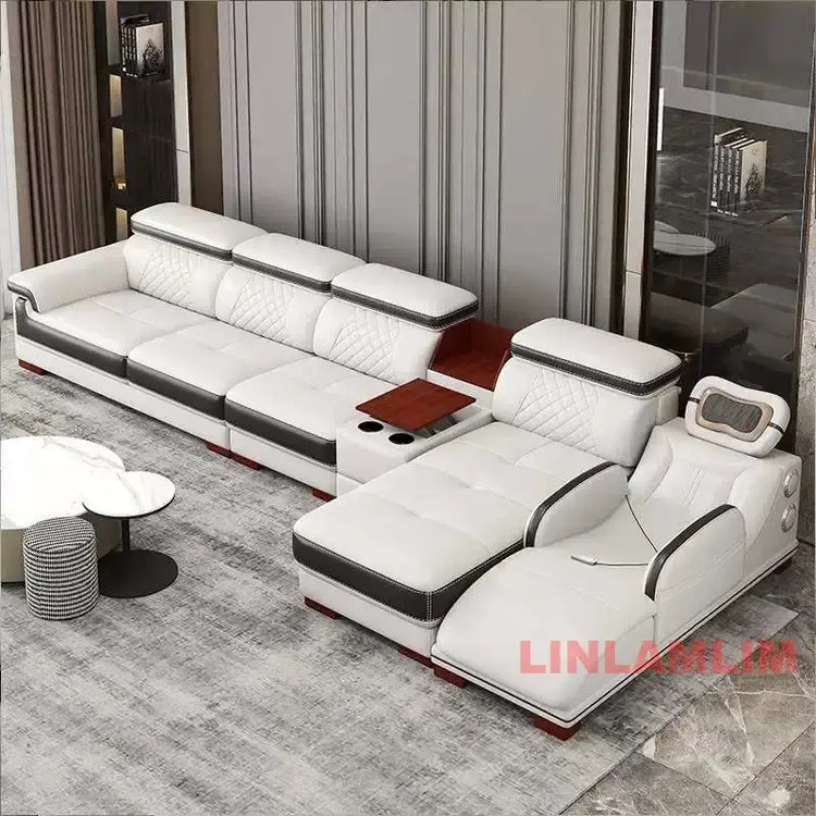 Luxury leather sectional sofa with massage chaise in modern living room, featuring cup holders and sleek design.