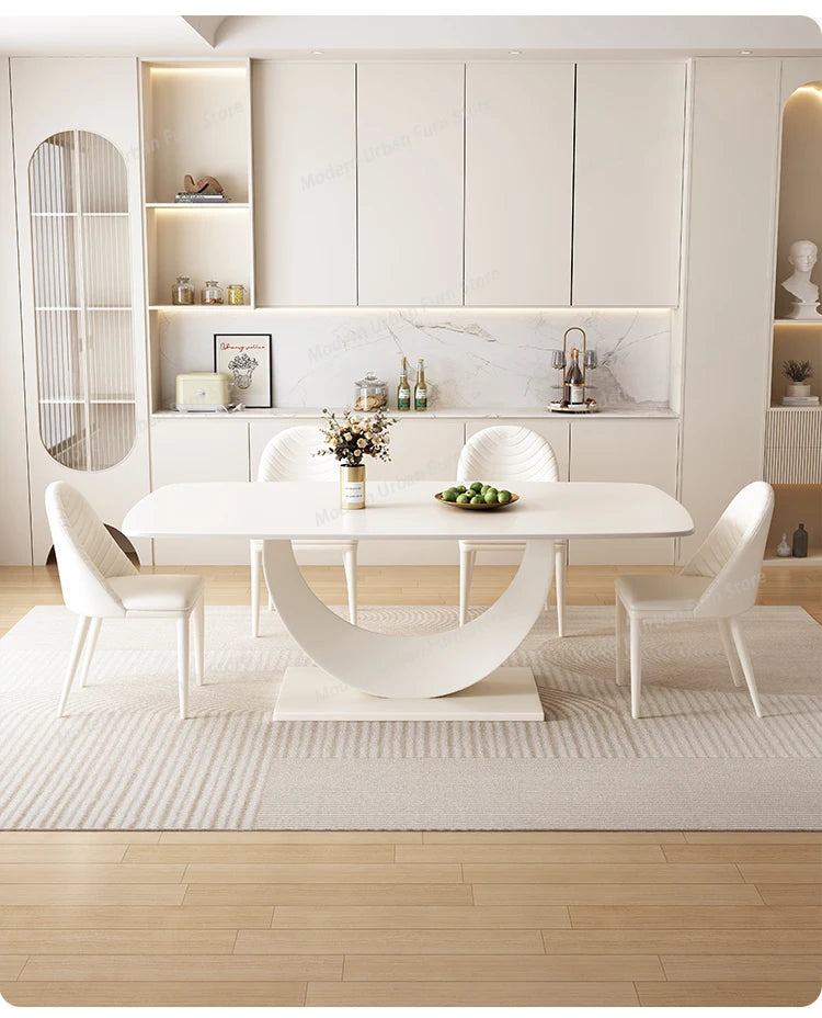 Luxury Nordic dining set displayed in a modern dining room with a slate tabletop and stylish white chairs.