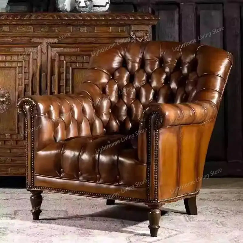 Brown leather armchair in a room with wooden furniture.